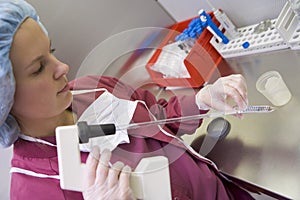 Embryologist processing sample