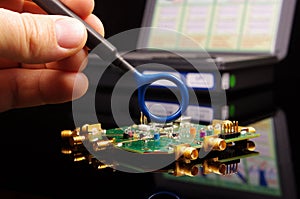 EMC engineer analyzing PCB using near-field probe