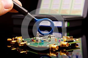 EMC engineer analyzing PCB using near-field probe