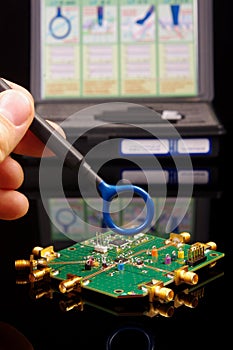 EMC engineer analyzing PCB using near-field probe