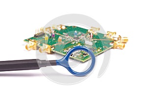 EMC engineer analyzing PCB using near-field probe
