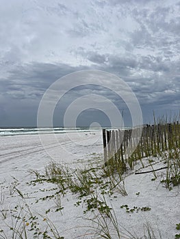 Emerald Coast Florida white sand beach with stormy skies