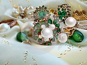 emerald greeen white pearl gold rings and earing jewelry on white background