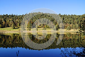 emerald-green lake Ober See near lake Alatsee on a fine autmn day in Bad Faulenbach (Fuessen, Bavaria in Germany)