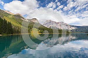 Emerald Lake and reflection with green pine of taiga forest and blue sky background in autumn at yoho national park of British