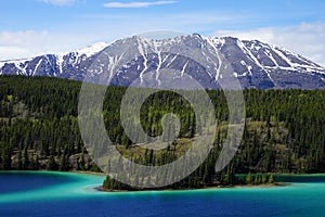 Emerald Lake, Yukon, Canada with mountains and forest on the background