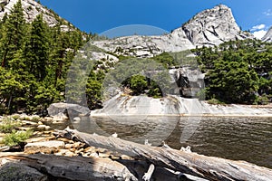 Emerald Pool and Liberty Cap in Yosemite National Park, California, USA.