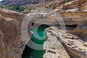 Emerald pools in Wadi Bani Khalid, Oman photo