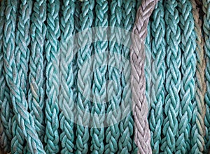 Emerald synthetic ship rope wound on drum close-up