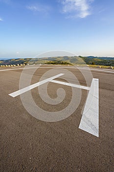 Empty helipad on top of a peak in a countryside remote location photo