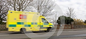Emergency ambulance speeds towards Accident and Emergency at Worthing, West Sussex