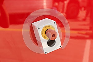 Emergency button on red background