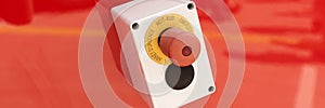 Emergency button on red background