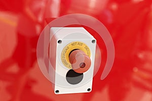 Emergency button on red background