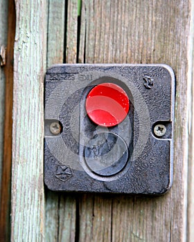 Emergency button on wooden background