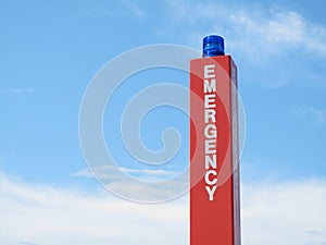 Emergency call box sign with blue strobe.