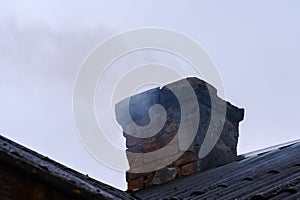 The emergency chimney smokes and operates in violation of fire safety