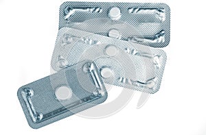 Emergency contraceptive pills in blister pack on blurred background of morning after pills. Drug cause of ectopic pregnancy. photo