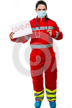 Emergency doctor pointing to Covid19 banner