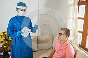 Emergency doctor putting a swab into a bag in hospital