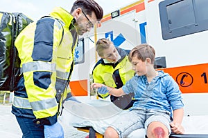 Emergency doctors caring for accident victim boy