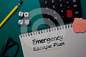 Emergency Escape Plan write on a book isolated on Office Desk
