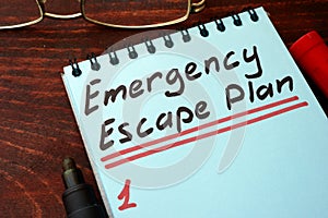 Emergency Escape Plan written on a notepad. photo