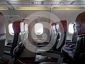 Emergency exit window in aircraft cabin. Long leg room seat. premium seat. Emergency exit seat.