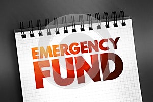 Emergency fund - personal budget set aside as a financial safety net for future mishaps or unexpected expenses, text on notepad photo
