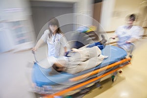 Emergency Hospital Nurses Pushing Litter Patient