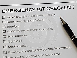 Emergency Kit Checklist and Ink Pen Shown Up Close