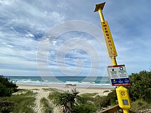 An emergency life saving beacon at a surf beach on a tropical island paradise off Queensland, Australia