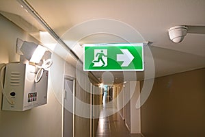 Emergency light and Emergency Fire exit sign at  the corridor