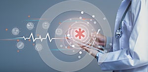 Emergency Medical Services concept. Doctor hand holding tablet and icon emergency medical network connection  on virtual screen