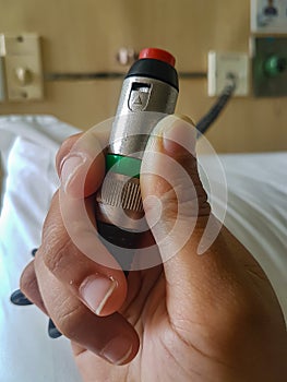 Emergency nurse call button in hospital room. emergency botton for patient on bed at hospital ward. health care concept. Close Up