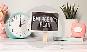 Emergency Plan text quote on notepad, concept background