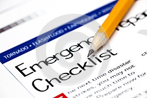 Emergency Preparedness Checklist with yellow pencil. photo