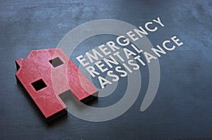 Emergency Rental Assistance Program ERAP. Red wooden home on the blackboard.