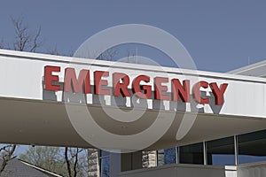 Emergency Room ER and Emergency Department entrance sign for a hospital in alert red