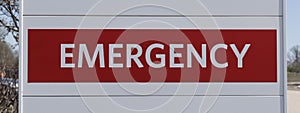 Emergency Room ER and Emergency Department entrance sign for a hospital in alert red