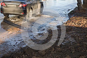 Emergency Sewerage. Water flows down the sidewalk from a ruptured underground sewer pipe. The accident of the city water supply. A