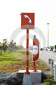 Emergency SOS phone sign and phone box on highway