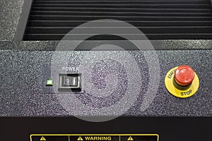 Emergency stop button in black equipment