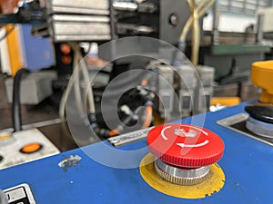 The Emergency stop button on control cabinet of   press machine