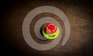 Emergency stop button, Disaster protection. Industrial concept. Red button on table in dark low key background
