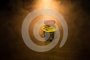 Emergency stop button, Disaster protection. Industrial concept. Red button on table in dark low key background