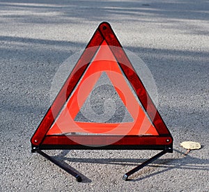 emergency stop sign on the background of the road. concept of roadside assistance, travel incidents, car repair