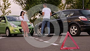 Emergency stop triangle sign afore Destroyed car in car crash traffic accident.