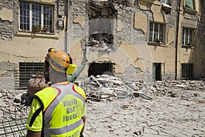 Fireman in earthquake rubble, Amatrice, Italy photo