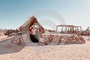 Emerging from an home built underground in desert Australia